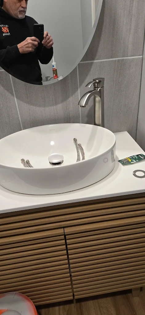 A new vessel sink and faucet installed by Graff's